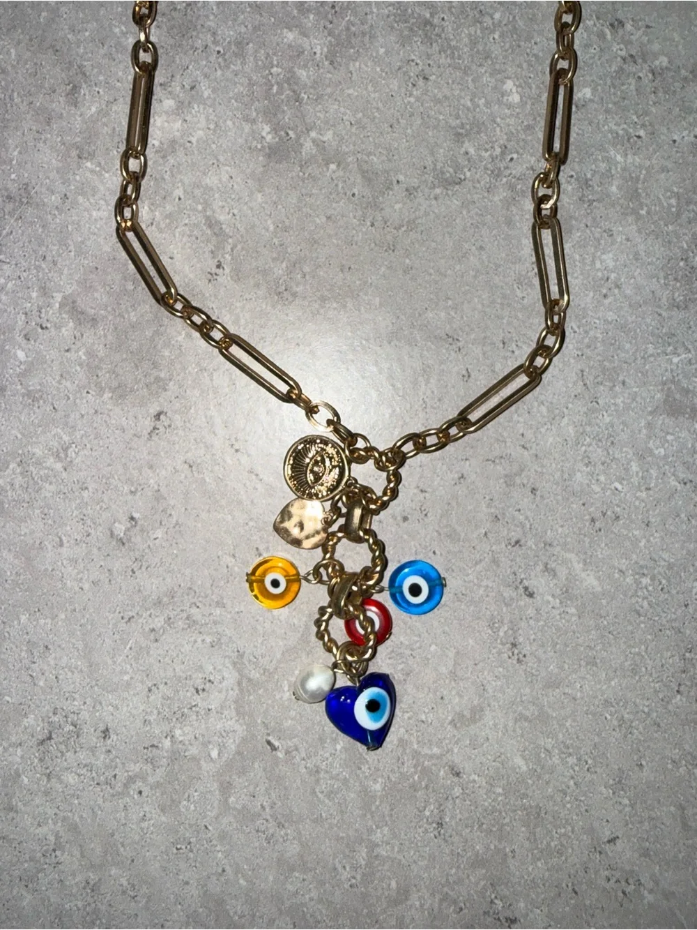 REVOLVE Gold Charm Necklace with Blue, Yellow, Red and White Evil Eye Accents